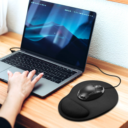 A woman using the black mouse pad with wrist rest on a laptop